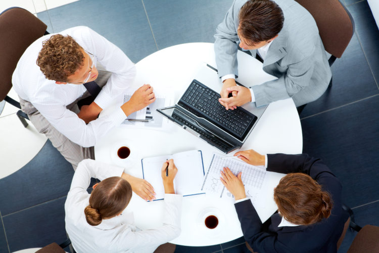 People working at the table with laptops - business