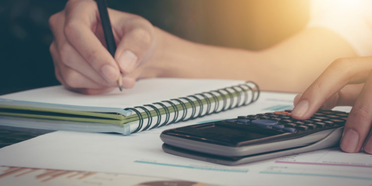 Woman making notes on the notepad