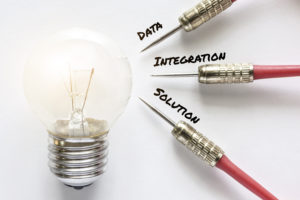 Data, integration and solution darts point at idea bulb