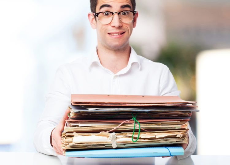 a person handling documents in the office