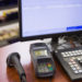A cash register on wooden table at supermarket