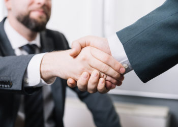 Businessman making a deal with the small company accountant