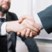 Businessman making a deal with the small company accountant