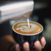 Barista Pouring Coffee To A Cup With Art