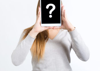 woman covered face with tablet