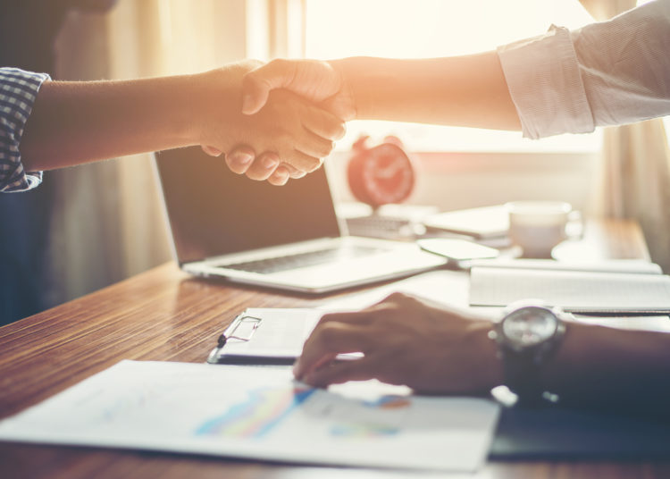 Business People Handshake Greeting Deal at work.