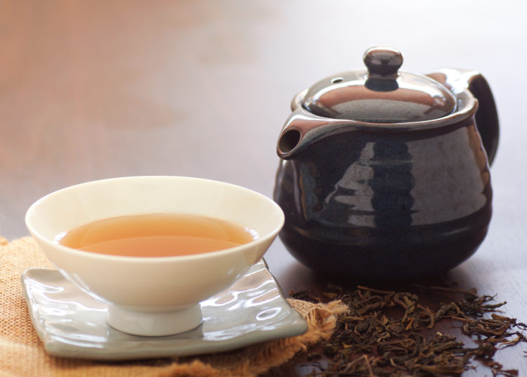 Green Tea In Cup And Pot On Wood Table