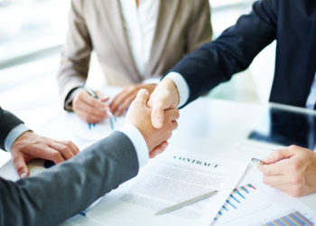 Handshake after signing a contract