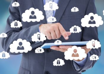 Software Management for SME cloud man holding a laptop