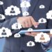 Software Management for SME cloud man holding a laptop