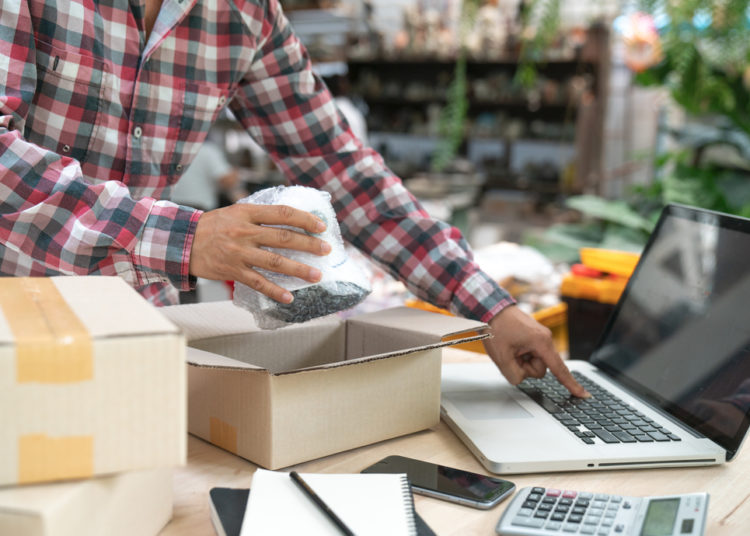 Shipping Shopping Online ,Young Start Up Small Business Owner Writing Address