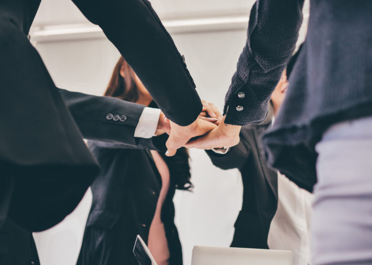 Close up hands of business team in meeting room,teamwork concept.