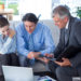 Couple in meeting with a financial adviser in living room