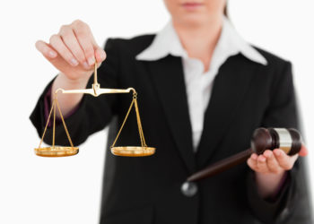 Woman holding atributes of Justice in Schengen Zone - Europe