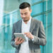 Businessman using his tablet computer software