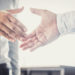 Handshake after good cooperation, Two Businessman handshake after discussing good deal of Trading contract and new projects for the company of real estate, Meeting and greeting concept.