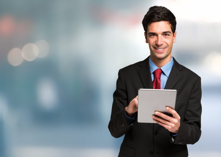 Businessman using his tablet.