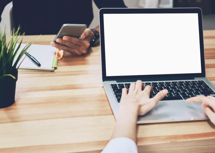 Women using a laptop on white screen, on-line marketing