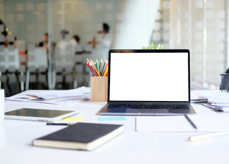 Table with laptop mock up Workplace Marketing Accounting business desk.