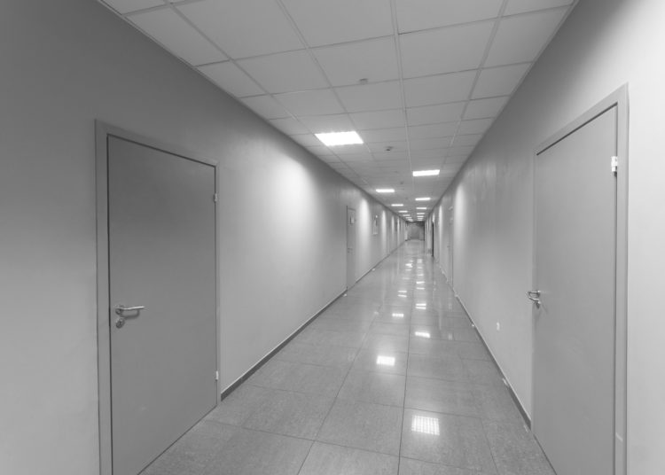 A long corridor with doors.