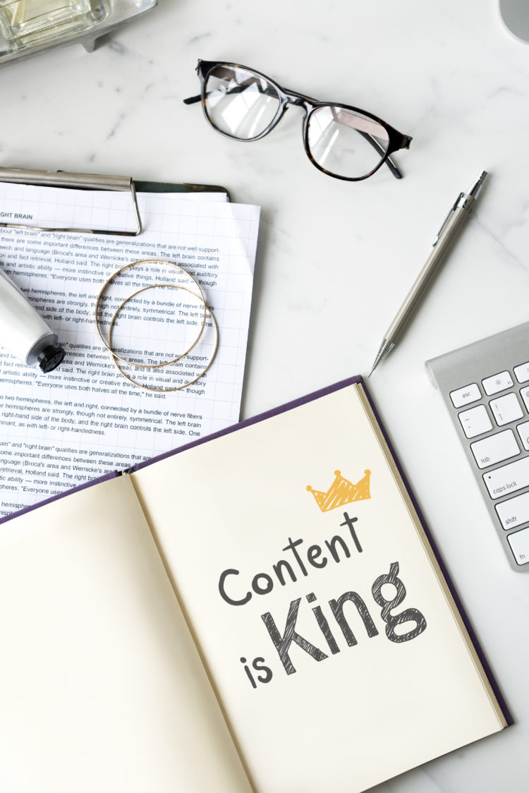 Content is king written on a notebook