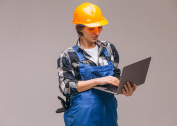 Woman repairer isolated with laptop