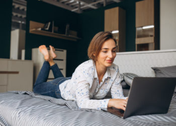 Young business woman working on a computer at home