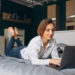 Young business woman working on a computer at home