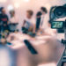 Video camera taking live video streaming at people working background