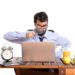 Businessman in his office with magnifying glass