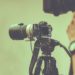 professional video camera with tripod stand by for shooting in studio production