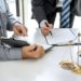 Male lawyer or Counselor working in courtroom have meeting with client are consultation with contract papers of real estate, Law and Legal services concept.