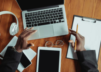 Businessman or student working from home while being isolated or keep quarantine of coronavirus covid-19