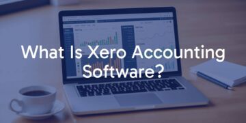 A modern laptop displaying Xero accounting software interface, clean and professional, with financial charts and graphs visible, workspace with coffee cup and notebook, bright and organized, digital finance theme.