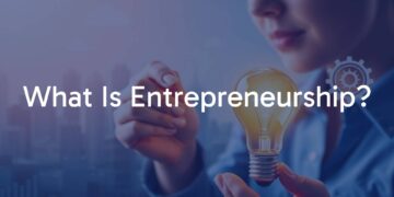 A person holding a lightbulb with business charts and icons like graphs, gears, and cityscape in the background, modern and motivational vibe.