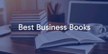 A stack of modern business books on a wooden desk, warm lighting, one book open showing highlighted text, laptop and coffee cup nearby, professional and inviting atmosphere, realistic style.